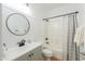 Charming bathroom with modern fixtures, a vanity and a shower-tub combination at 45475 W Guilder Ave, Maricopa, AZ 85139