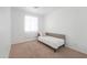 Cozy bedroom with neutral walls, carpeted flooring, and a comfortable bed provides a peaceful retreat at 45475 W Guilder Ave, Maricopa, AZ 85139