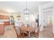 Bright dining room adjacent to a modern kitchen and open living space at 45475 W Guilder Ave, Maricopa, AZ 85139