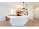 Modern kitchen with white countertops and stainless steel appliances at 45475 W Guilder Ave, Maricopa, AZ 85139