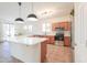 Lovely kitchen with stainless appliances and modern light fixtures at 45475 W Guilder Ave, Maricopa, AZ 85139