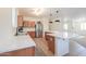 Well-lit kitchen with sleek countertops and stainless steel refrigerator at 45475 W Guilder Ave, Maricopa, AZ 85139