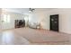 A comfortable living room with plenty of natural light and a ceiling fan at 45475 W Guilder Ave, Maricopa, AZ 85139