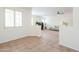 Inviting living space with tiled flooring, neutral paint, and natural lighting perfect for relaxation at 45475 W Guilder Ave, Maricopa, AZ 85139