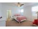 The main bedroom features a doorway to the main bathroom, neutral paint, and carpeted flooring at 45475 W Guilder Ave, Maricopa, AZ 85139