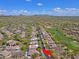 Aerial view of a golf community with stunning homes and mountain views at 6714 E Amber Sun Dr, Scottsdale, AZ 85266