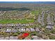 Aerial view of a golf community with beautiful homes and desert landscaping at 6714 E Amber Sun Dr, Scottsdale, AZ 85266