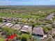 Aerial view of a golf community with beautiful homes and desert landscaping at 6714 E Amber Sun Dr, Scottsdale, AZ 85266