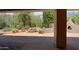 Covered patio with view of backyard with pond, water feature, and pizza oven at 6714 E Amber Sun Dr, Scottsdale, AZ 85266