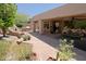 Spacious backyard with an outdoor kitchen, water feature, and comfortable lounge area, ideal for relaxing at 6714 E Amber Sun Dr, Scottsdale, AZ 85266