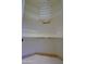 Walk-in closet featuring wire shelving and travertine tile at 6714 E Amber Sun Dr, Scottsdale, AZ 85266