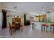 A naturally-lit dining room is adjacent to the wet bar and kitchen at 6714 E Amber Sun Dr, Scottsdale, AZ 85266
