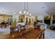 Spacious dining room flowing into the wet bar and living area at 6714 E Amber Sun Dr, Scottsdale, AZ 85266