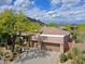 Stunning aerial view of a home with a three-car garage and beautiful desert landscaping at 6714 E Amber Sun Dr, Scottsdale, AZ 85266