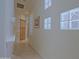 Hallway features unique glass block windows and built-in shelving adding architectural interest at 6714 E Amber Sun Dr, Scottsdale, AZ 85266