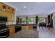 Open kitchen with island, granite counters, stainless appliances, and views of the backyard at 6714 E Amber Sun Dr, Scottsdale, AZ 85266