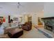 Living space showing bar seating, a fireplace and comfortable seating at 6714 E Amber Sun Dr, Scottsdale, AZ 85266