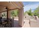 Cozy outdoor kitchen area with grill and pizza oven, perfect for entertaining at 6714 E Amber Sun Dr, Scottsdale, AZ 85266