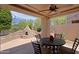 Charming outdoor kitchen features a pizza oven, built-in seating, and stylish patio furniture at 6714 E Amber Sun Dr, Scottsdale, AZ 85266