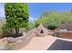 Backyard with custom pizza oven, BBQ, and seating area at 6714 E Amber Sun Dr, Scottsdale, AZ 85266