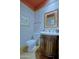 Elegant powder room with decorative mirror, carved cabinet sink, and custom paint at 6714 E Amber Sun Dr, Scottsdale, AZ 85266