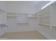 Large, walk-in closet with ample shelving and organizational racks for storage and convenience at 6714 E Amber Sun Dr, Scottsdale, AZ 85266
