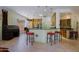 Open concept kitchen features a wet bar and breakfast seating at 6714 E Amber Sun Dr, Scottsdale, AZ 85266