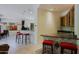 A stylish wet bar with granite countertops and seating space at 6714 E Amber Sun Dr, Scottsdale, AZ 85266