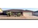 Well-maintained single-story brick home showcasing desert landscaping and an attached two-car garage at 8025 E Medina Ave, Mesa, AZ 85209