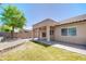 View of backyard covered patio, desert landscaping, and privacy block fence at 902 W Saragosa St, Chandler, AZ 85225