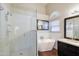 Modern bathroom featuring soaking tub, glass shower, dual sinks, and neutral color palette at 902 W Saragosa St, Chandler, AZ 85225