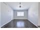 Bright bedroom features wood floors, neutral paint and a ceiling fan for optimal comfort at 902 W Saragosa St, Chandler, AZ 85225