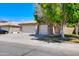 Traditional single story home featuring a two-car garage and manicured desert landscaping at 902 W Saragosa St, Chandler, AZ 85225
