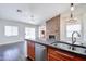 Open kitchen layout with stainless steel appliances and eat-in bar, perfect for entertaining at 902 W Saragosa St, Chandler, AZ 85225