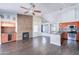 Open-concept living space featuring a stacked stone fireplace and wood-look flooring at 902 W Saragosa St, Chandler, AZ 85225