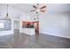 Bright living area with wood-look floors, showcasing the kitchen with stainless appliances at 902 W Saragosa St, Chandler, AZ 85225