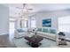 Bright and airy living room with a vaulted ceiling, comfortable seating, and filled with natural light at 902 W Saragosa St, Chandler, AZ 85225