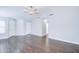 Open-plan living area with hardwood floors, bright natural light, and neutral colored walls at 902 W Saragosa St, Chandler, AZ 85225