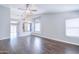 Spacious living room features hardwood floors, an arched window, and ample natural light at 902 W Saragosa St, Chandler, AZ 85225