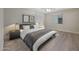 Relaxing bedroom with modern decor, a ceiling fan, and a large window at 9423 W Monte Vista Rd, Phoenix, AZ 85037