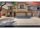 Attractive two-story home with a three-car garage and desert landscaping at 9423 W Monte Vista Rd, Phoenix, AZ 85037
