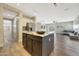 Spacious kitchen featuring an island with granite countertops and stainless steel appliances at 9423 W Monte Vista Rd, Phoenix, AZ 85037