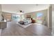 Bright main bedroom with a sitting area, ceiling fan, and a view of the outdoors at 9423 W Monte Vista Rd, Phoenix, AZ 85037