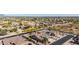 Beautiful aerial view of a suburban neighborhood showcasing well-maintained homes and desert landscape with desert foliage at 1019 N Tambor Cir, Mesa, AZ 85207