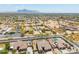 Expansive aerial view of community with lush trees and sparkling pools at 1019 N Tambor Cir, Mesa, AZ 85207