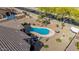 View of a backyard featuring a kidney shaped pool with desert landscaping creating a serene and private retreat at 1019 N Tambor Cir, Mesa, AZ 85207