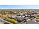 Picturesque aerial view of a residential community in Arizona featuring desert landscaping and stunning mountain views at 1019 N Tambor Cir, Mesa, AZ 85207