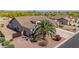 Aerial shot showcasing a home with desert landscaping, two-car garage, and a private yard at 1019 N Tambor Cir, Mesa, AZ 85207