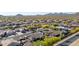 High aerial showcasing a desert community with mountain views, and a mix of desert landscaping and desert foliage at 1019 N Tambor Cir, Mesa, AZ 85207