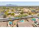 Wide angle aerial view of residential neighborhood with pools and mountain views at 1019 N Tambor Cir, Mesa, AZ 85207